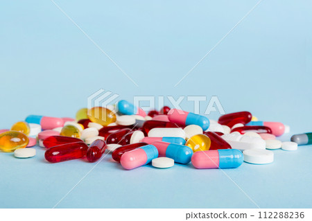 Many different colorful medication and pills perspective view. Set of many pills on colored background Many different colorful medication and pills perspective view. Set of many pills on colored background 112288236