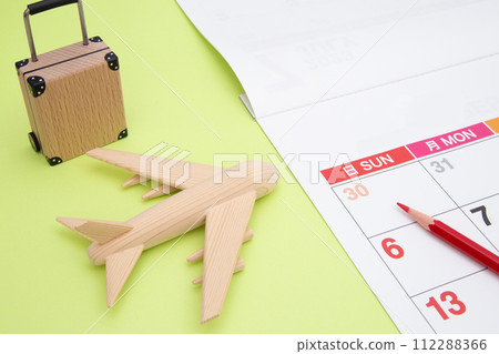 Passenger plane, suitcase and calendar Passenger plane, suitcase and calendar 112288366