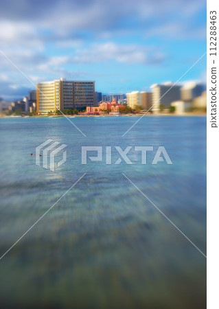 Ocean, city blur and buildings with landscape, travel and destination with skyscraper and outdoor. Urban development, architecture and environment for tourism, adventure and location with blue sky Ocean, city blur and buildings with landscape, travel and destination with skyscraper and outdoor. Urban development, architecture and environment for tourism, adventure and location with blue sky 112288463