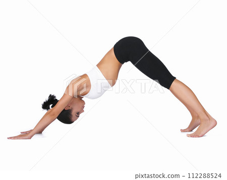 Woman, yoga and stretching body in workout, exercise or training on a white studio background. Young female person or yogi in warm up, balance or pose for zen, pilates or fitness on mockup space Woman, yoga and stretching body in workout, exercise or training on a white studio background. Young female person or yogi in warm up, balance or pose for zen, pilates or fitness on mockup space 112288524