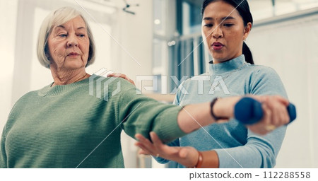 Senior care, training and physiotherapist with old woman, dumbbell and healthcare for nursing. Physio, rehabilitation and retirement with fitness, caregiver with elderly patient for mobility exercise Senior care, training and physiotherapist with old woman, dumbbell and healthcare for nursing. Physio, rehabilitation and retirement with fitness, caregiver with elderly patient for mobility exercise 112288558