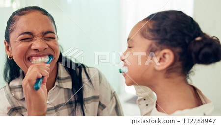 Happy, brushing teeth and mother with daughter, wellness and child development in bathroom. Smile, family or mama with kid and healthy with morning routine or toothbrush with fresh breath or dental Happy, brushing teeth and mother with daughter, wellness and child development in bathroom. Smile, family or mama with kid and healthy with morning routine or toothbrush with fresh breath or dental 112288947