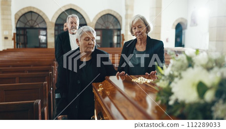 Senior women, coffin and funeral in church for memory, support and condolences with religion with family. Community, friends and together for death, loss and service with empathy, faith and casket Senior women, coffin and funeral in church for memory, support and condolences with religion with family. Community, friends and together for death, loss and service with empathy, faith and casket 112289033