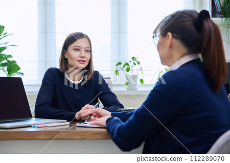 Young woman patient at meeting with psychologist, mental therapist 112289070