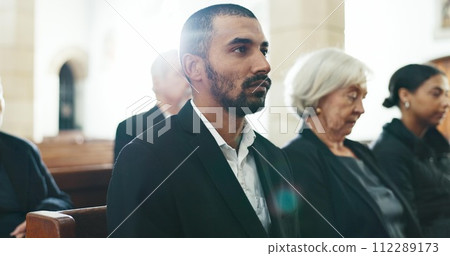 Sad, man and face closeup with depression at a funeral in church for religious service and mourning. Grief, male person and burial with death, ceremony and grieving loss at chapel event in a suit 112289173
