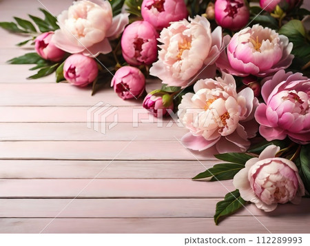Beautiful peony flowers on wooden background, closeup. Space for text 112289993