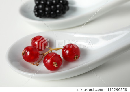 Ripe berries on the table on a light background. 112290258