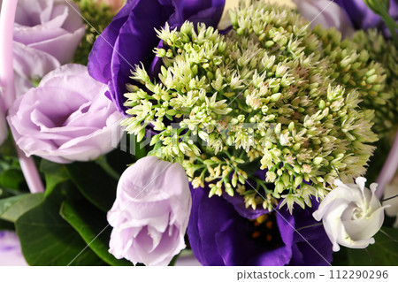 Bouquet of fresh flowers, close-up, side view. 112290296