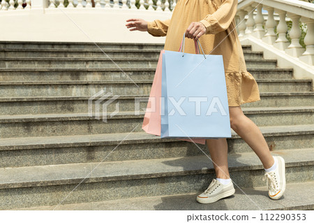 Shopping bags, on the street, on the background of steps. 112290353