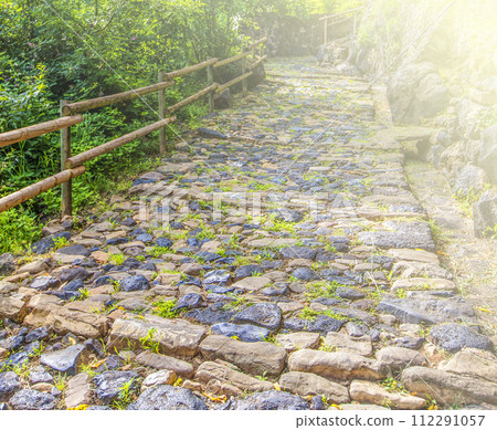Old stone road on soft sunlight with copy space 112291057