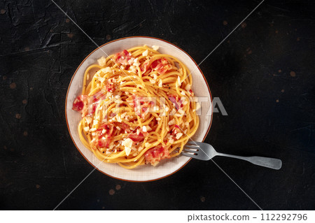 Carbonara pasta dish, traditional Italian spaghetti with pancetta and cheese Carbonara pasta dish, traditional Italian spaghetti with pancetta and cheese 112292796