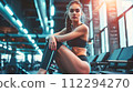 Woman Exercising in a Modern Gym 112294270