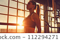 Woman Exercising in a Modern Gym 112294271
