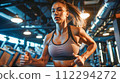 Woman Exercising in a Modern Gym 112294272