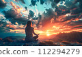 Woman Overlooking the Sunset and Sunrise on a Mountain 112294279