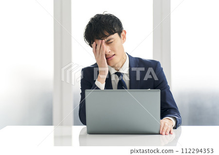 Businessman having problems at work 112294353