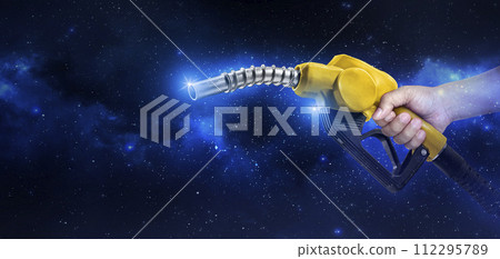 Hands holding Fuel nozzle floating in the Planet view from space Hands holding Fuel nozzle floating in the Planet view from space 112295789
