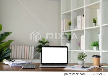 Mock up blank white screen laptop, book and home decor. Sustainability eco friendly lifestyle 112295932