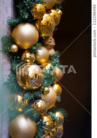 Christmas street decor. Christmas balls on tree branches on winter city streets. Soft focus. Christmas in Europe.Christmas season in Europe. Winter holiday decor Christmas street decor. Christmas balls on tree branches on winter city streets. Soft focus. Christmas in Europe.Christmas season in Europe. Winter holiday decor 112296499