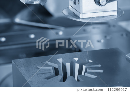 Closeup scene the wire EDM machine cutting the mold parts. 112296917
