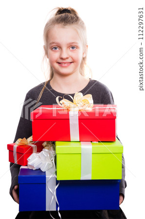 Child with a lot of gift boxes in hands on isolated background Child with a lot of gift boxes in hands on isolated background 112297631