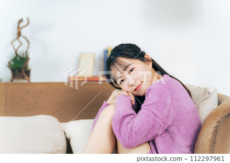 A woman relaxing in loungewear A woman relaxing in loungewear 112297961