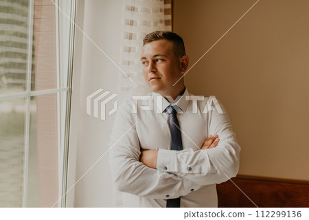 a man preparing for an important event a meeting indoors worries 112299136