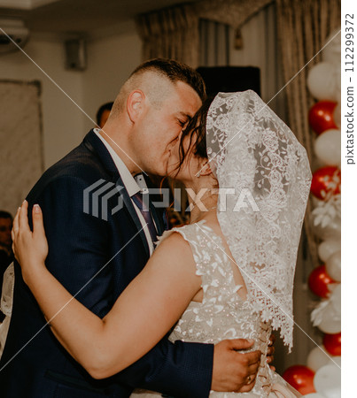 groom and bride already with their heads covered shawl hustka hug kissing dancing groom and bride already with their heads covered shawl hustka hug kissing dancing 112299372