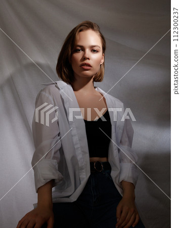 Portrait of beautiful young brunette woman with Portrait of beautiful young brunette woman with 112300237