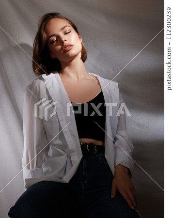 Portrait of beautiful young brunette woman with Portrait of beautiful young brunette woman with 112300239