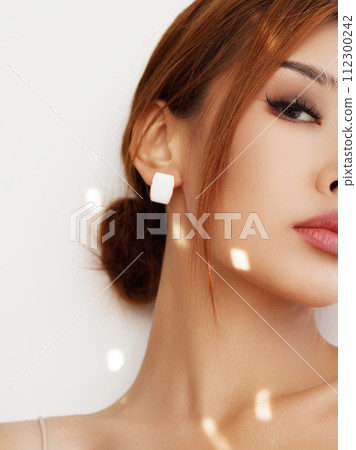 Beautiful young asian woman with clean fresh skin 112300242