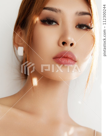 Beautiful young asian woman with clean fresh skin Beautiful young asian woman with clean fresh skin 112300244
