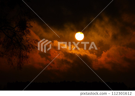 bright sun against the background of clouds 112301612