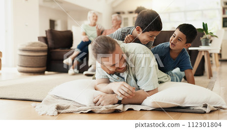 Funny, playing and father with children on floor in home living room laughing at comedy, joke or humor. Happy, dad and kids having fun, bonding and enjoying family time together in adoption house. 112301804