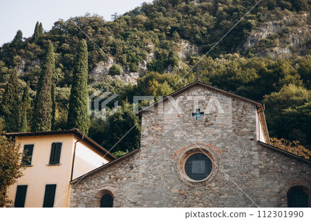 Exterior view of the Chiesa San Giorgio in the Piazza San Giorgio in the picturesque village of Varenna, Italy. Exterior view of the Chiesa San Giorgio in the Piazza San Giorgio in the picturesque village of Varenna, Italy. 112301990