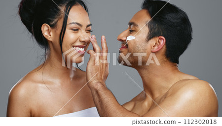 Couple, smile and love for skincare, care and portrait with moisturizer in studio by gray background. Happy people, dermatology and hug for cosmetics, hydration and creme or love for skin treatment Couple, smile and love for skincare, care and portrait with moisturizer in studio by gray background. Happy people, dermatology and hug for cosmetics, hydration and creme or love for skin treatment 112302018