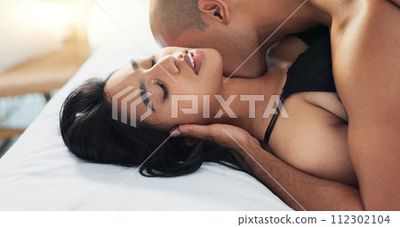 Sex, man woman with neck kiss, passion and intimacy for love and lust in marriage with couple in bed together. Foreplay, seduction and trust with romance on Valentines day and sexual moment at home 112302104