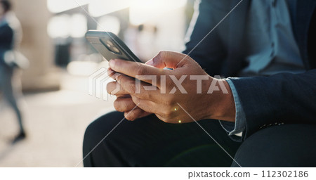 Hands, phone and closeup of businessman in the city networking on social media, mobile app or internet. Technology, typing and professional male person on website with cellphone in urban town. Hands, phone and closeup of businessman in the city networking on social media, mobile app or internet. Technology, typing and professional male person on website with cellphone in urban town. 112302186