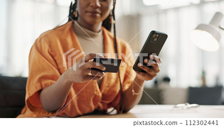 Woman, credit card and hands with phone for online shopping, payment or fintech savings at home. Closeup, mobile banking and finance for sales, password and code for ecommerce to upgrade subscription 112302441