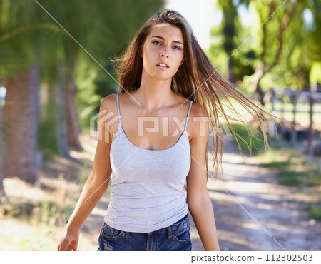 Portrait, woman and glow for casual, fashion and hair for natural, styling and outfit in Argentina. Gen z, female person and tank top for stylish, confidence and trendy clothes for weekend getaway Portrait, woman and glow for casual, fashion and hair for natural, styling and outfit in Argentina. Gen z, female person and tank top for stylish, confidence and trendy clothes for weekend getaway 112302503