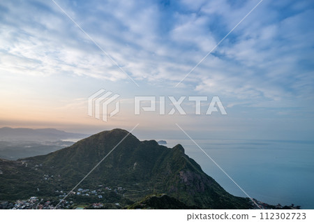 View the sea and moving clouds from the top of the mountain. View the sea and moving clouds from the top of the mountain. 112302723