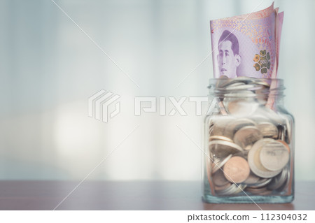 Money in the glass with filter effect retro vintage style and soft focus 112304032