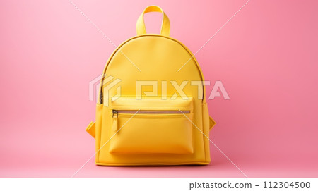 Yellow school backpack on a pink background. Yellow school backpack on a pink background. 112304500