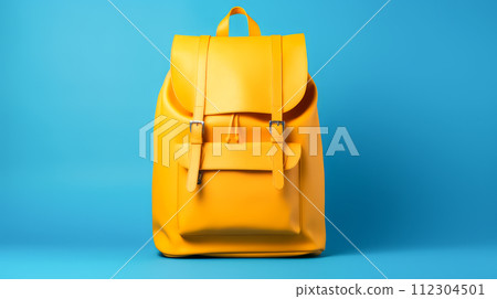 Yellow school backpack on a blue background. Yellow school backpack on a blue background. 112304501