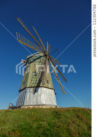 windmill dutch type against blue sky 112304788