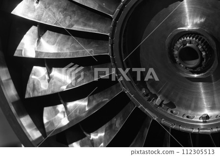 Turbine rotor. Turbojet engine close up black and white photo 112305513