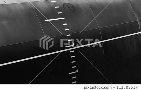 Black military submarine hull with waterline and draft scale 112305517