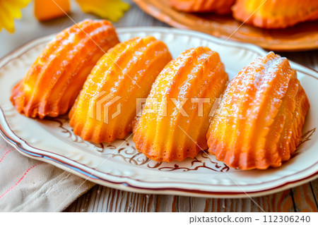Classic French madeleine cookies, buttery and delicate, mini sponge cake baked in scallop mold 112306240