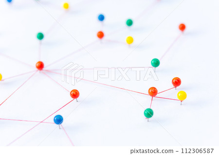 Linking entities, Blockchain, social media, Communications Network, The connection between the two networks. Network simulation on paper linked together by yarn Linking entities, Blockchain, social media, Communications Network, The connection between the two networks. Network simulation on paper linked together by yarn 112306587