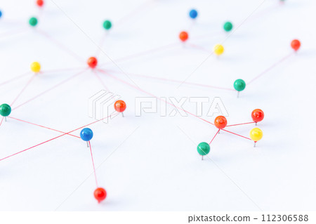 Linking entities, Blockchain, social media, Communications Network, The connection between the two networks. Network simulation on paper linked together by yarn Linking entities, Blockchain, social media, Communications Network, The connection between the two networks. Network simulation on paper linked together by yarn 112306588